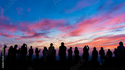 Silhouette of people with sunset.