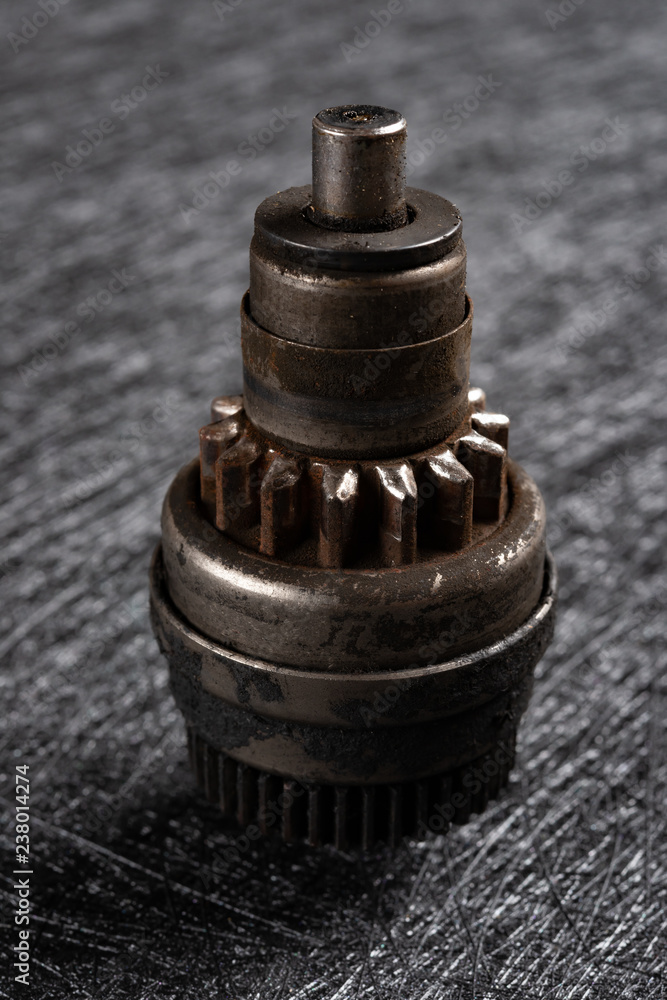 used shaft gear on dark background used shaft gear on dark background