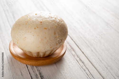 traditional Chinese bun on white wood background