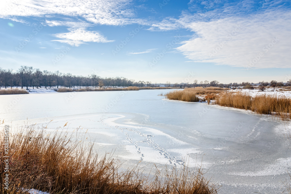 Frozen lake in a winter sunny day. Frozen lake in a winter sunny day.