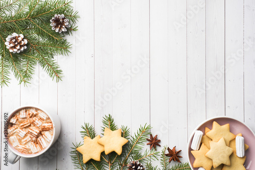 Christmas composition. Hot chocolate cookies, pine branches, cinnamon sticks, anise stars. Christmas, winter concept. Flat lay, top view