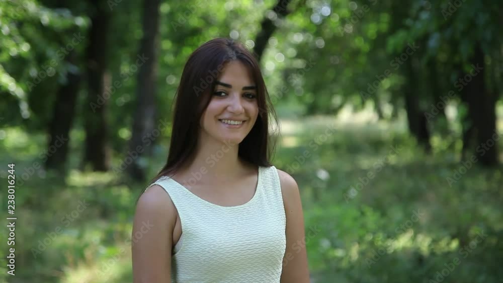 pretty young girl smiling in the forest pretty young girl smiling in the forest
