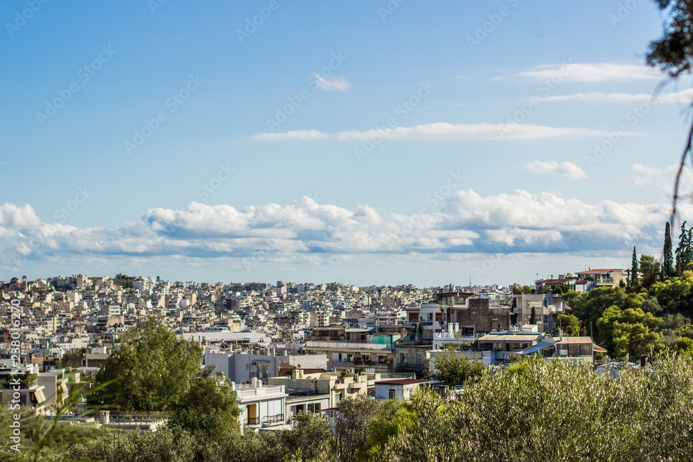 big south America city foreshortening from above with many white small buildings horizon border with blue sky