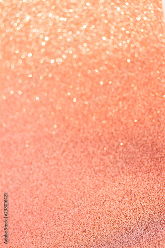 Christmas holiday glittering defocused living coral pink background with bokeh lights