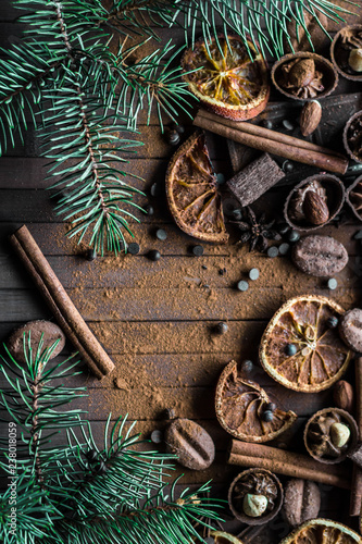 Christmas sketch. Lots of chocolate and chocolates, cinnamon, orange dried slices and spruce twigs. Holiday Decor. Close-up. Copy space.