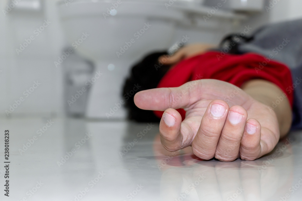 man falling in the bathroom because the cerebrovascular accident or stroke with with soft-focus and over light in the background