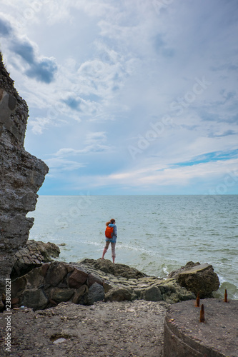 LIEPAJA, LATVIA - JULY 21, 2017: girl standing on the ruins of Northern forts photo