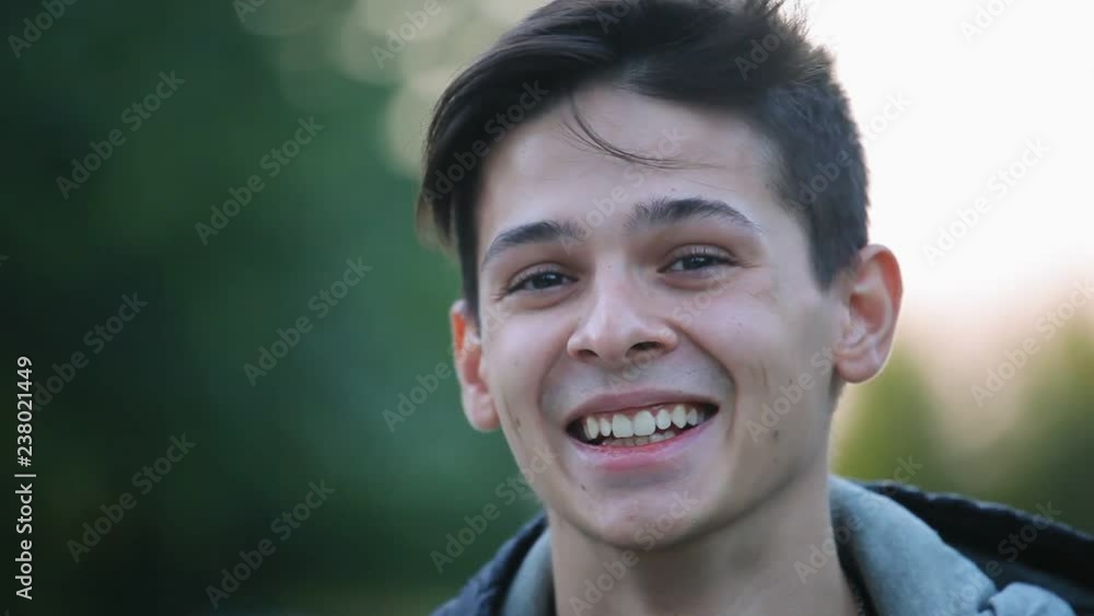 portraite of emotional positive young boy outdoors in the evening portraite of emotional positive young boy outdoors in the evening