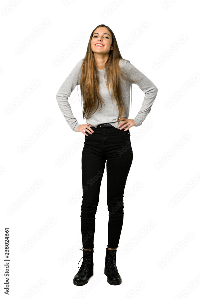 Full-length shot of young girl happy and smiling on isolated white background Full-length shot of young girl happy and smiling on isolated white background