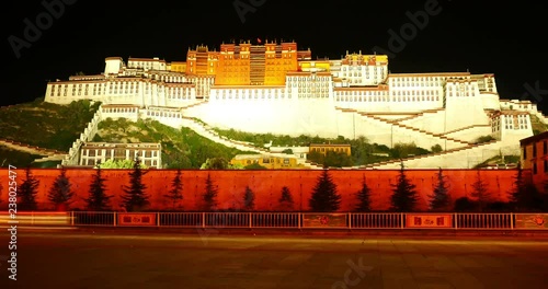 4k busy traffic in front of the Potala at night in Lhasa,Tibet. photo