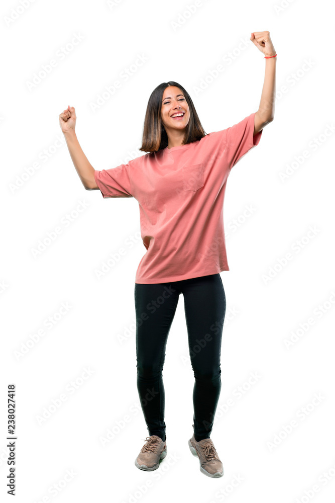 Full body of Young girl with pink shirt celebrating a victory in winner position Full body of Young girl with pink shirt celebrating a victory in winner position