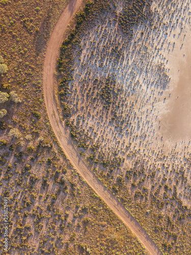 Salt lake and dirt road photo