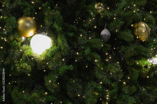 christmas tree in close-up look, full of decorations and lights, giving the atmosphere of magical christmas in december.