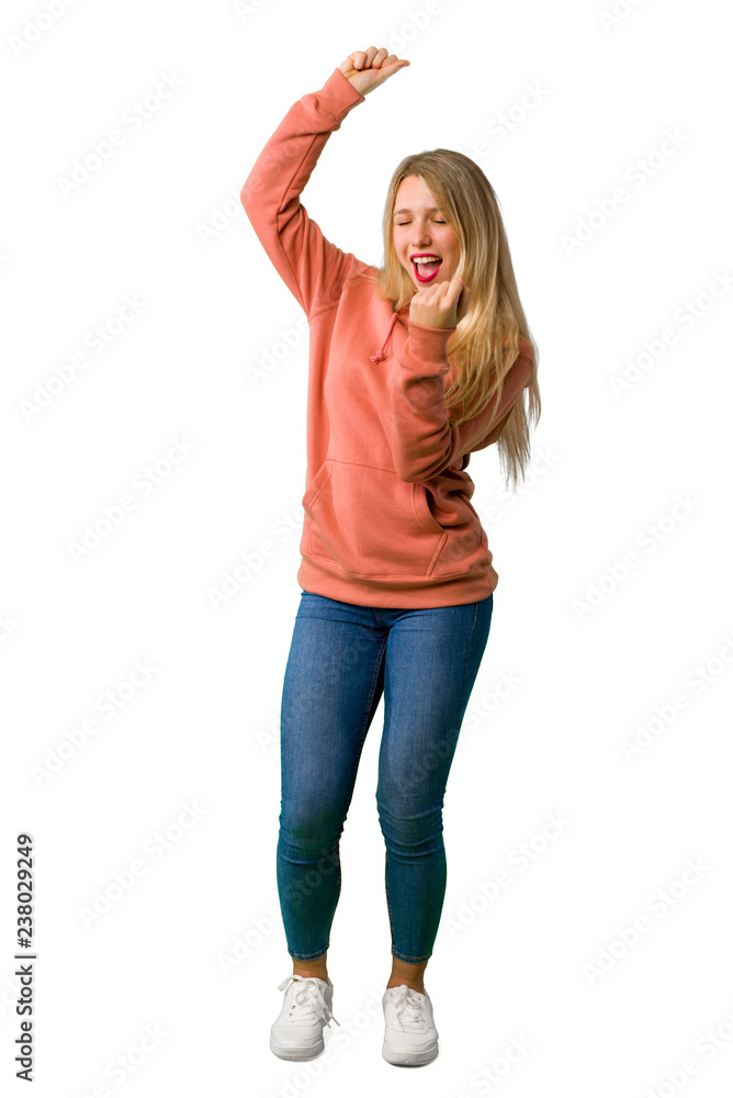 A full-length shot of a Young girl celebrating a victory on isolated white background A full-length shot of a Young girl celebrating a victory on isolated white background