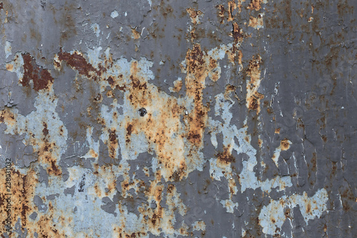 Old peeling paint on a rusty metal surface. Grunge texture.