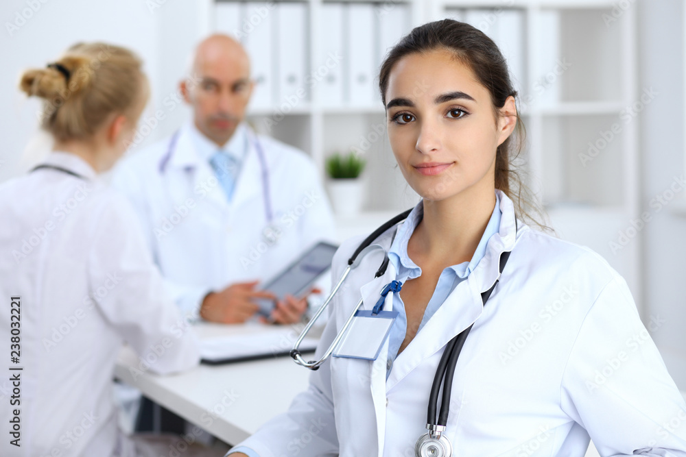Portrait of young doctor woman in hospital. Hispanic or latin american staff in medicine Portrait of young doctor woman in hospital. Hispanic or latin american staff in medicine