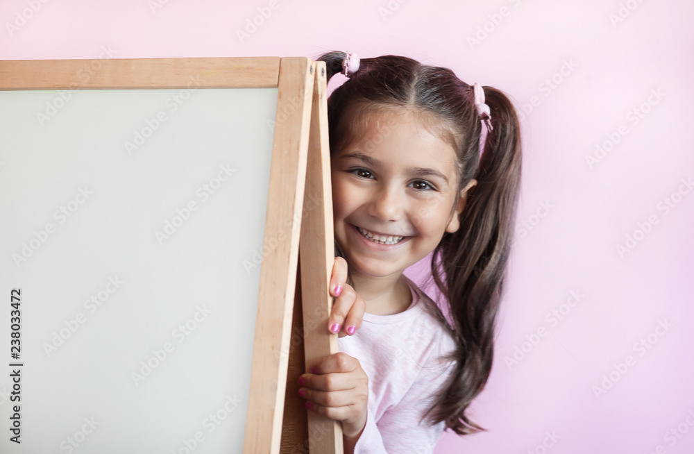 Back to school. Cute little child girl with blackboard. Back to school. Cute little child girl with blackboard.