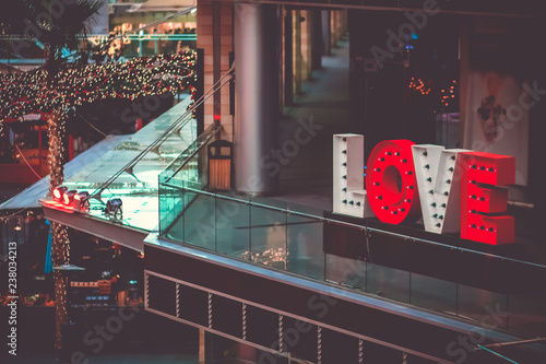 Canvas Print Red and white letters LOVE sign Neon led tube  located on public walking at Boulevard Amman, Jordan