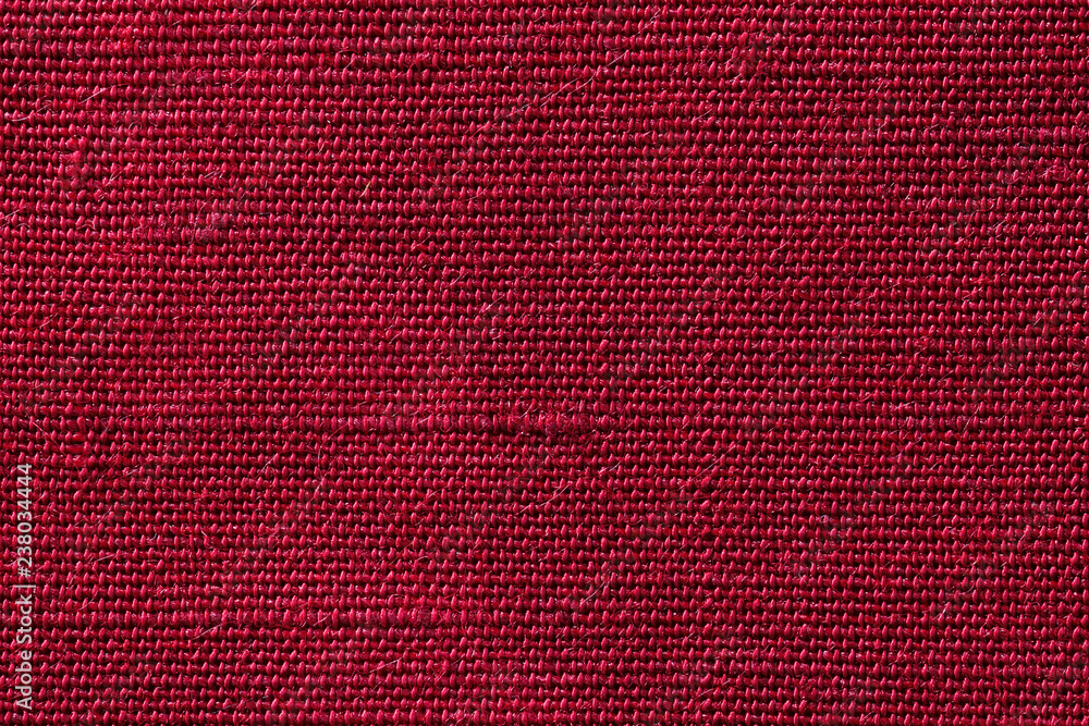 Fototapeta premium Red fabric of cloth texture background. Detail of textile material close-up.