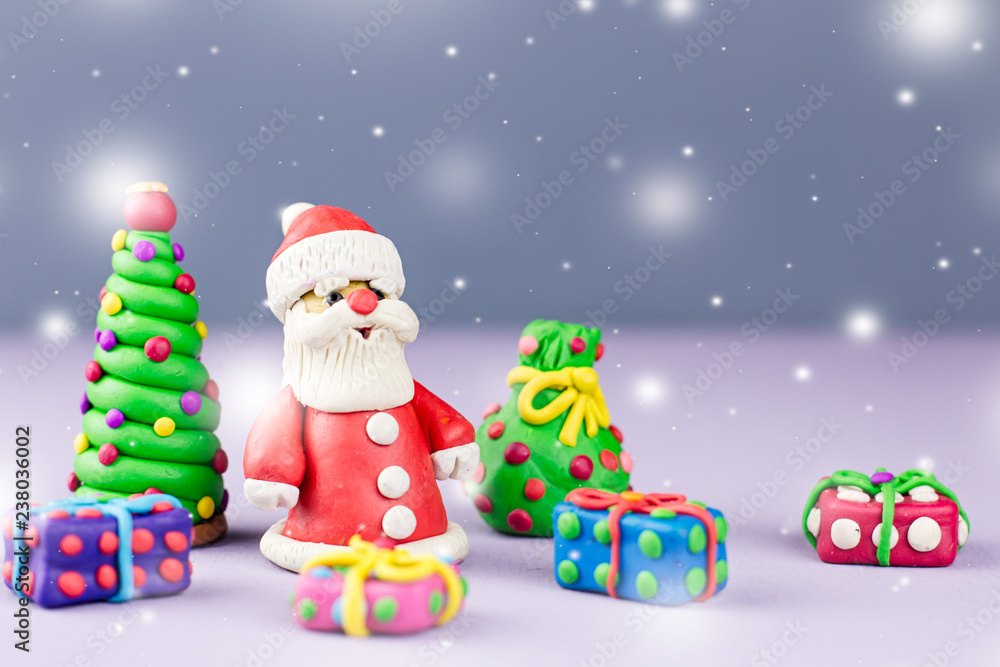 Merry Christmas greeting card with decorations. Santa Claus, Christmas tree and presents with snow falling Merry Christmas greeting card with decorations. Santa Claus, Christmas tree and presents with snow falling