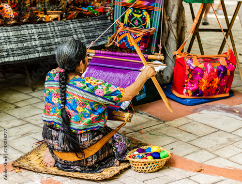 Woman weaving in an old village in Guatemala.  Traditional waver from Guatemala. photo