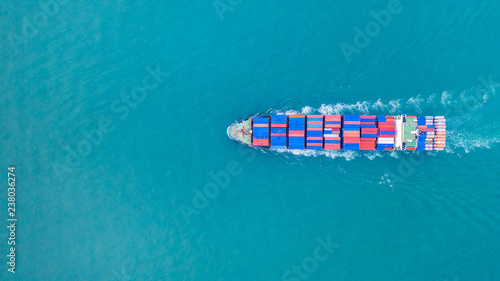 Aerial view cargo container ship carrying container for import and export, business logistic and transportation by ship in open sea