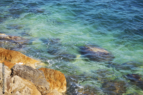 Rocks in the Mediterranean sea without waves