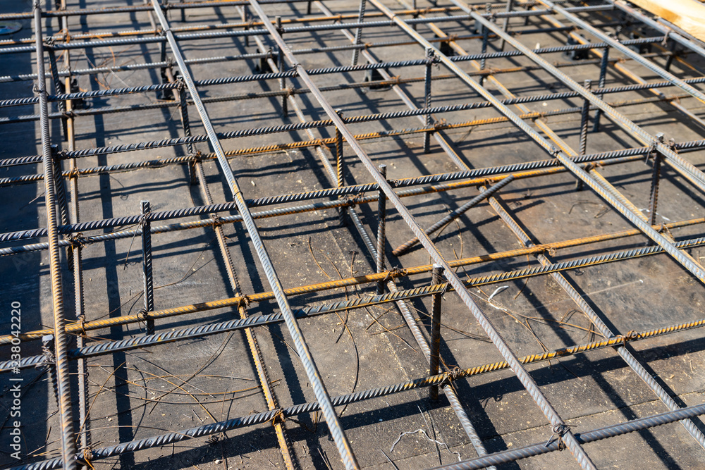 Tie rebar beam cage on construction site. Steel reinforcing bar for reinforced concrete.