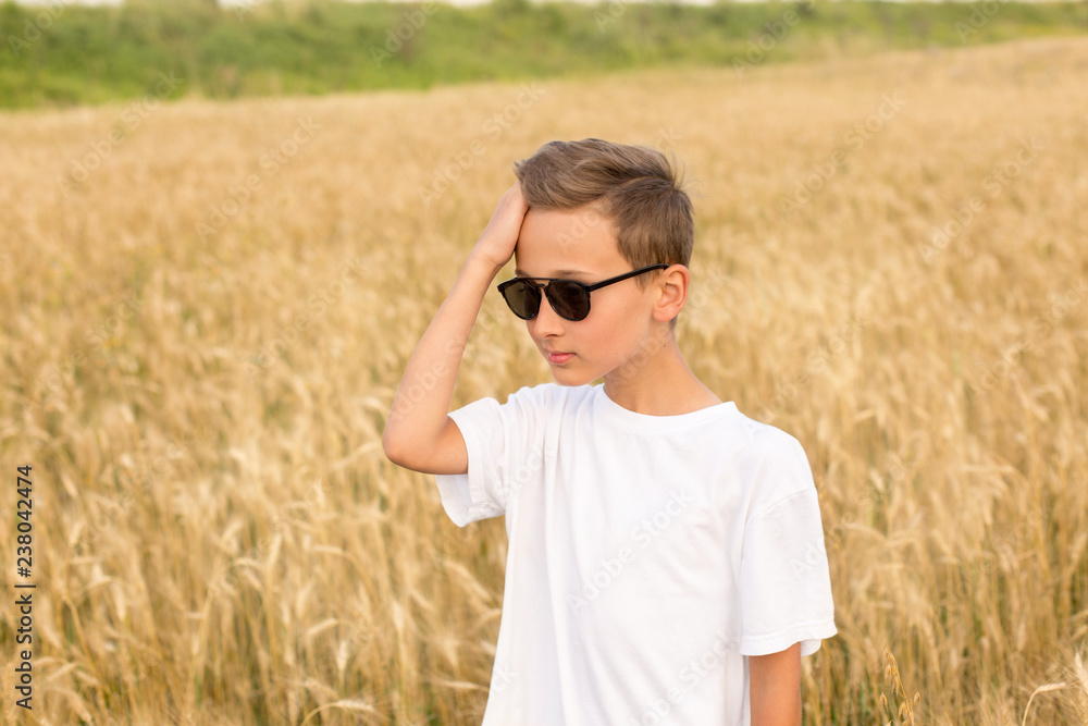 boy in wheat field. child. wheat field. boy with sunglasses boy in wheat field. child. wheat field. boy with sunglasses