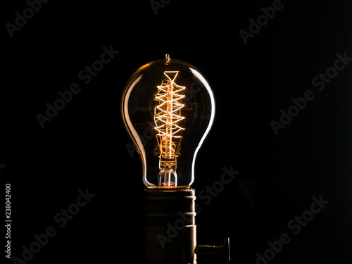 Fotobehang Edison's light bulb illuminates from electric current