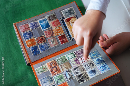 the child looks album with stamps
