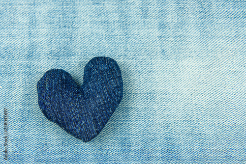 The heart of blue denim on a blue denim background. photo
