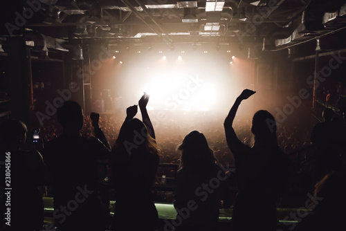 People at the concert watching music show from the balcony