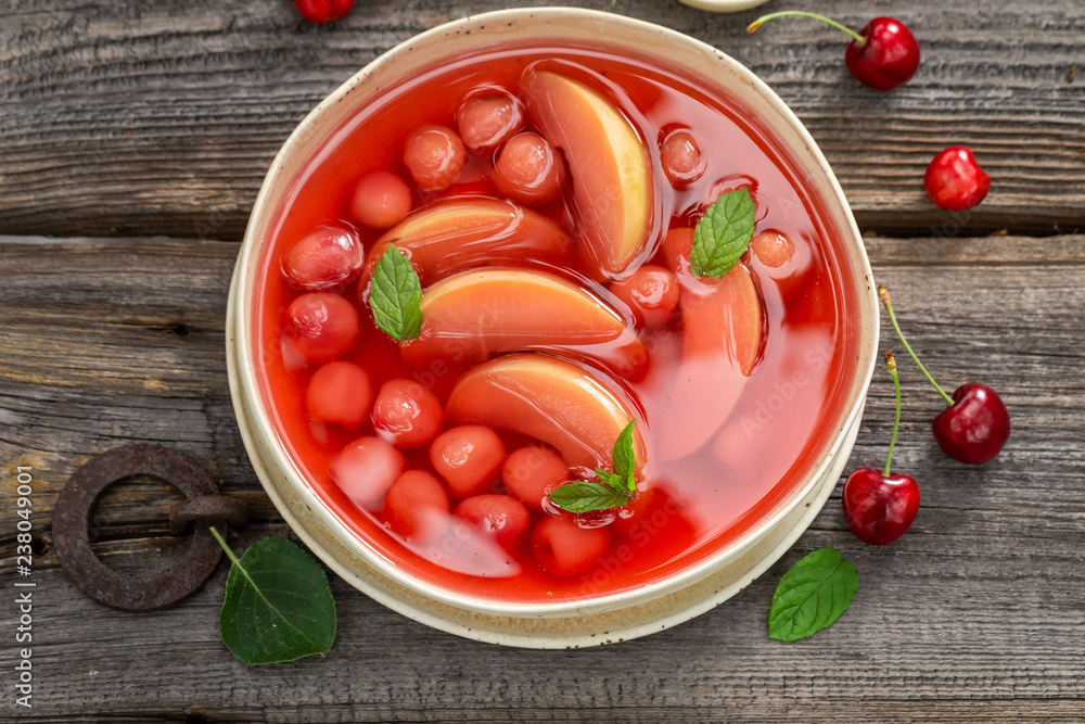 Delicious fruit soup with cherries, apples and mint Delicious fruit soup with cherries, apples and mint