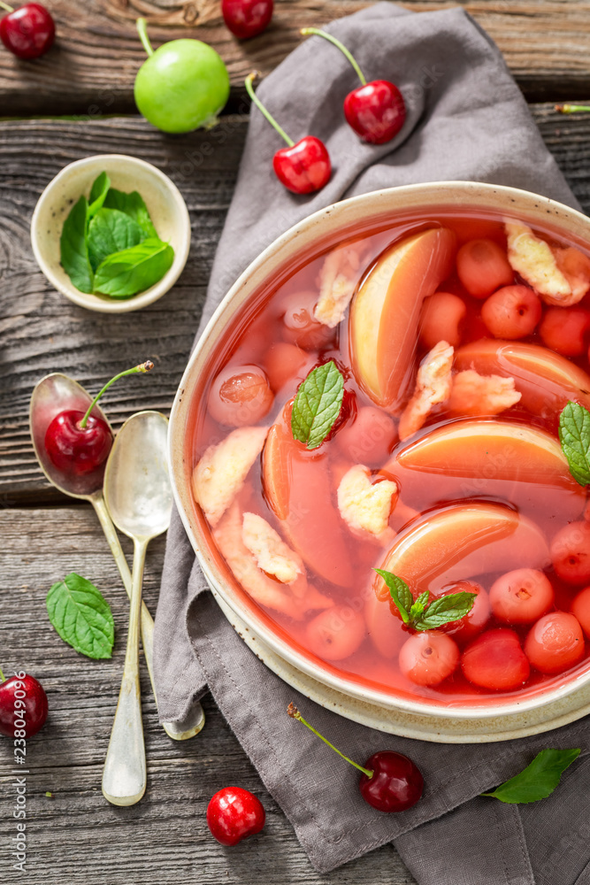 Yummy fruit soup with cherries, apples and mint - obrazy, fototapety, plakaty 