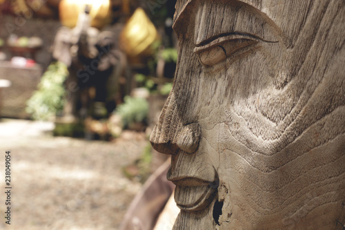 Buddha statue wooden old from B.Tawai, Chiang Mai, Thailand photo