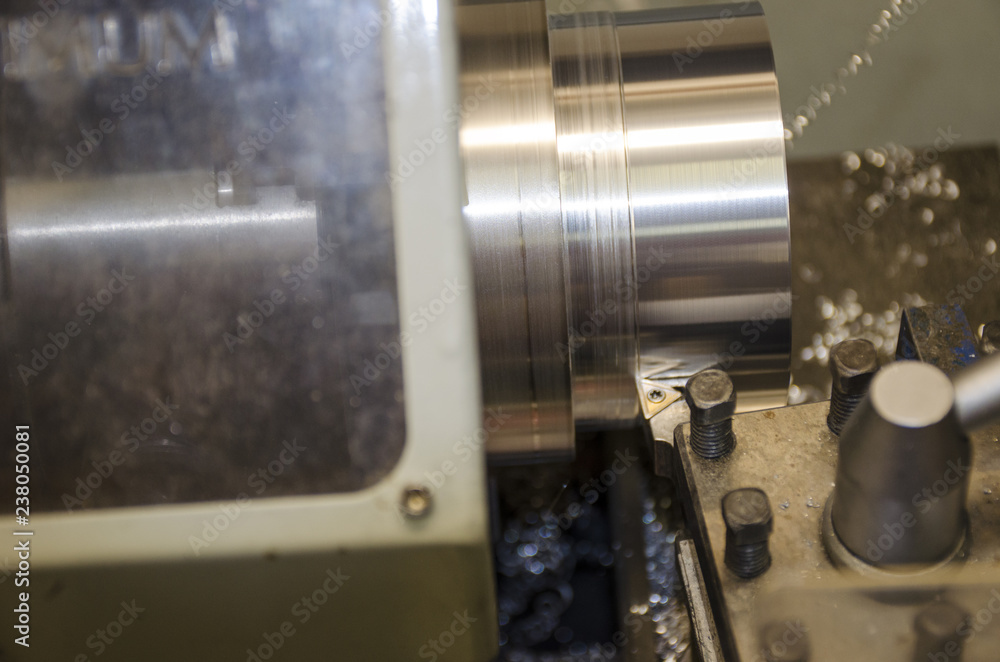 Detail of work at lathe with aluminium metal Detail of work at lathe with aluminium metal