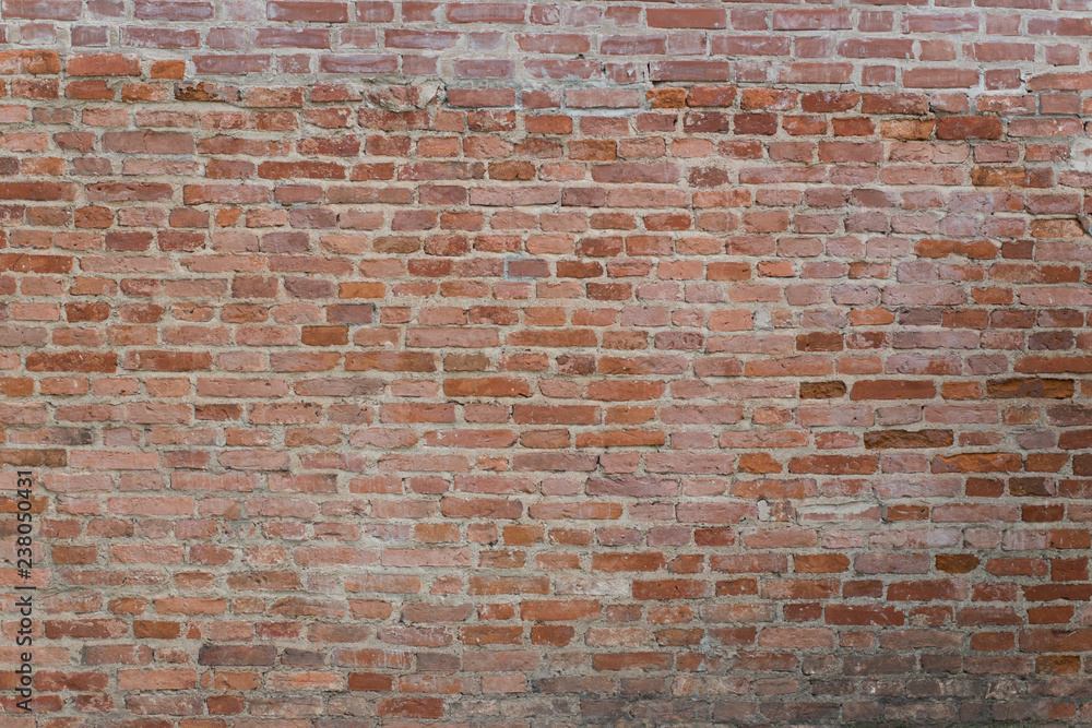 Red old brick wall background day time Red old brick wall background day time