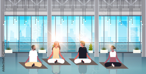 mix race people sitting lotus position doing sport fitness exercises meditation relaxation concept modern gym interior male female cartoon characters flat horizontal