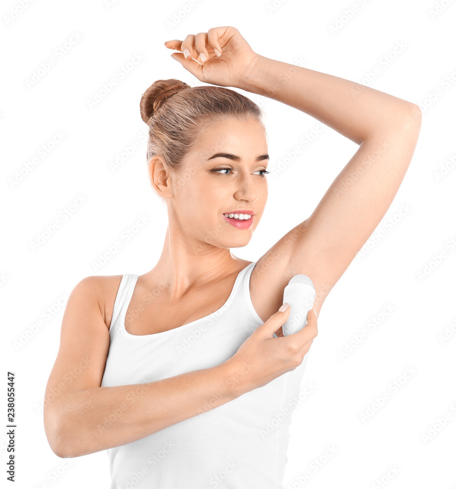 Young woman using deodorant on white background Young woman using deodorant on white background