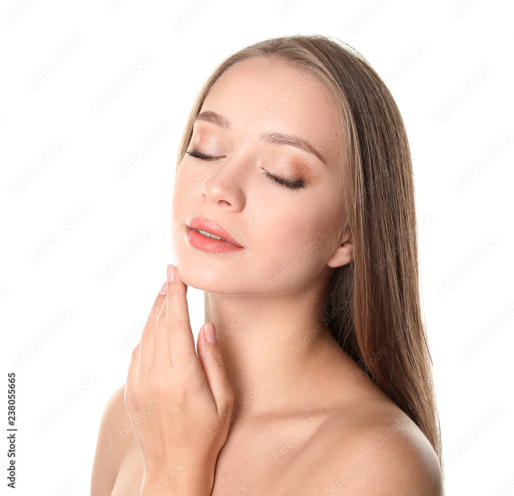 Portrait of beautiful young woman with natural makeup on white background