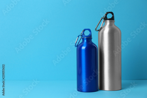Sport bottles with space for text on color background