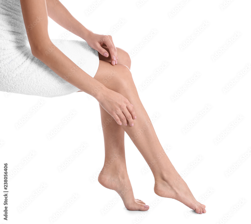 Woman with beautiful legs and feet on white background, closeup. Spa treatment Woman with beautiful legs and feet on white background, closeup. Spa treatment
