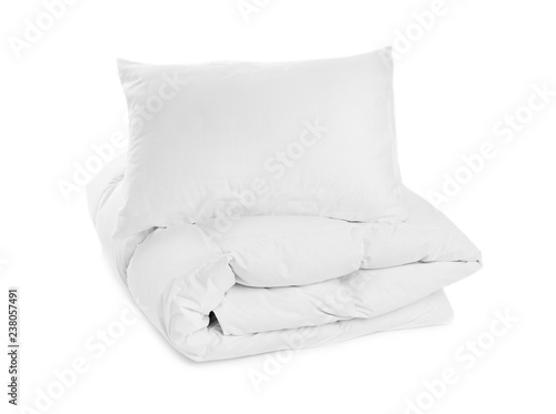 Clean blanket and pillow on white background