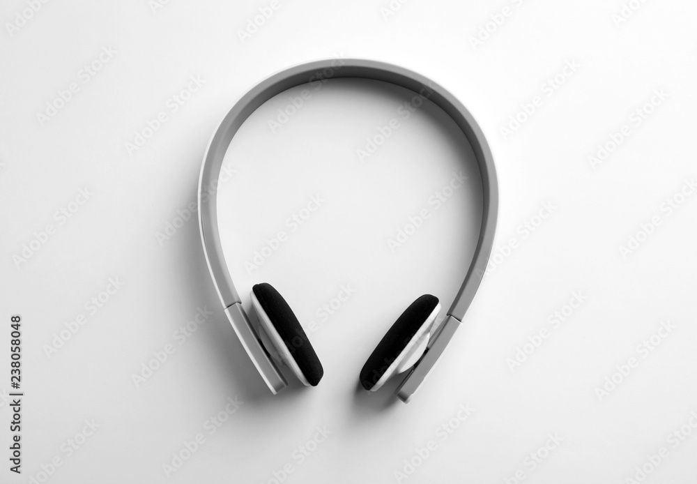Stylish modern headphones with earmuffs on white background Stylish modern headphones with earmuffs on white background