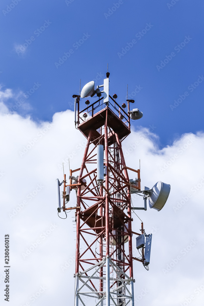 Communications tower  complete with various antennas and microwave and satellite dishes