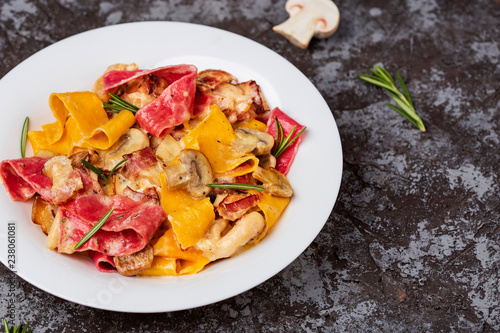 colored papardelle with chicken, bacon and mushrooms