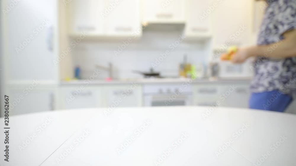 Unrecognizable man putting the plate with fresh clean apples Unrecognizable man putting the plate with fresh clean apples