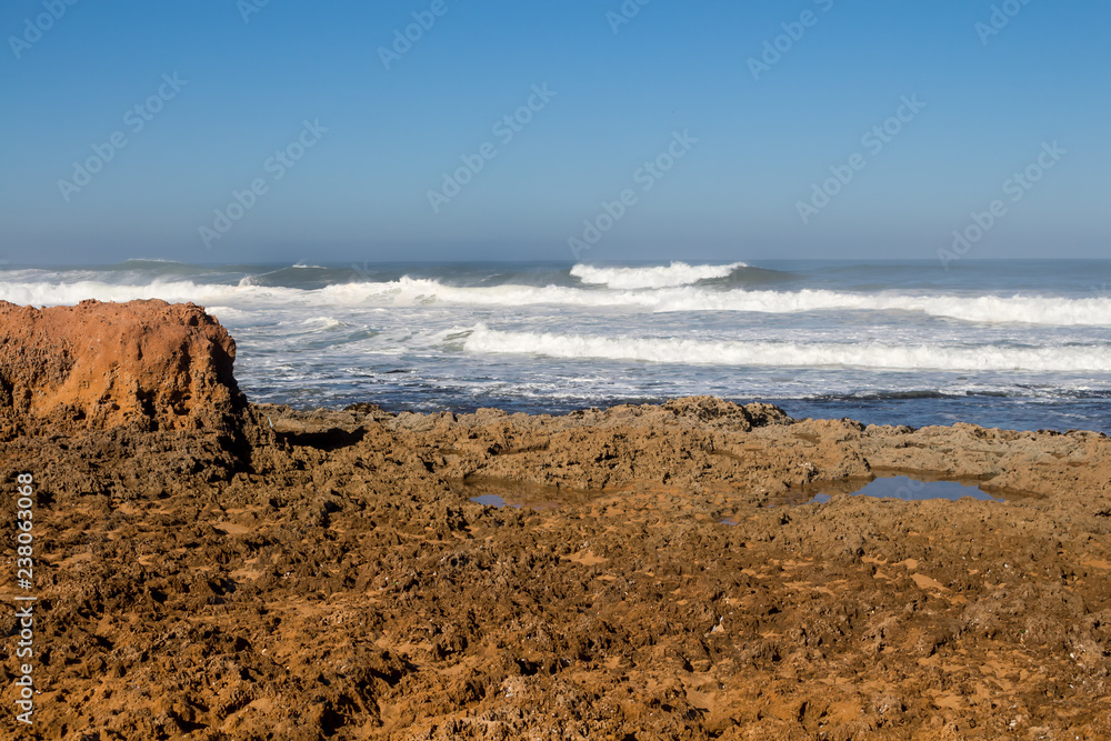 Rocky part of the Atlantic ocean coast beach, Morocco Rocky part of the Atlantic ocean coast beach, Morocco