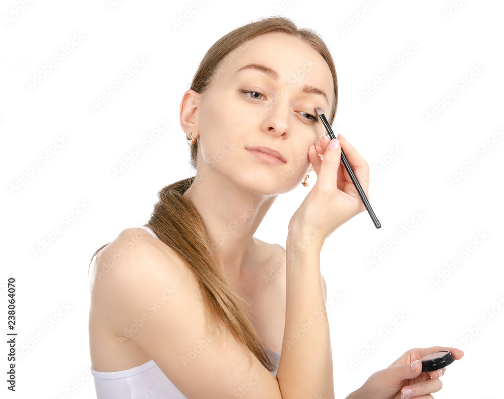 Beautiful woman beauty fashion eyeshadow brush in hand on white background isolation Beautiful woman beauty fashion eyeshadow brush in hand on white background isolation